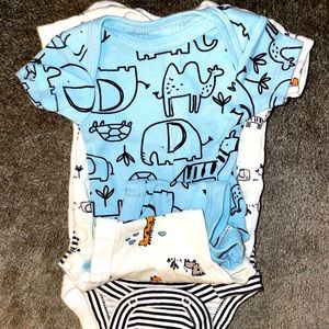 About 5-10 New Born Gerber Onsies.